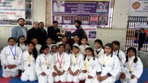 Young players posing along with dignitaries and officials at Dogra Brahmin Pratinidhi Sabha in Jammu.