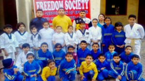 Winners of belt grading test organised by Freedom Society posing for group photograph. 