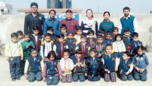 Prize winners of Karate-do Championship posing along with officials at Hello Kids School in Jammu on Saturday.