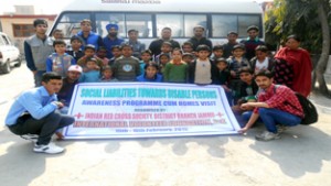 Students posing for a group photograph during the awareness programme organized by International Volunteers Foundation in Jammu.