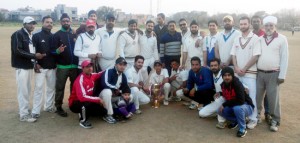 Jubilant players of RCC Srinagar posing for a group photograph after lifting the KC Hyundai Cup T20 title in Jammu on Tuesday.