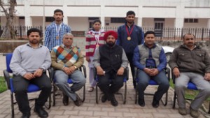 Dignitaries and students posing for a group photograph during Felicitation Function at GDC Billawar on Wednesday.