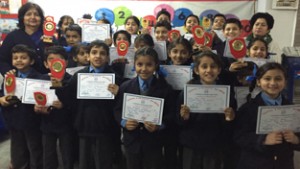 Winners of various competitions displaying certificates while posing for a group photograph in Jammu on Wednesday.