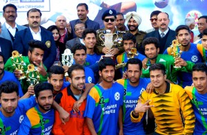 Players of Kashmir United Football Club posing for a group photograph after winning the Christmas Soccer Cup Championship at GGM Science College in Jammu