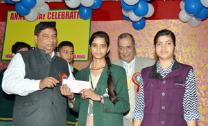 Chief guest felicitating the winner during annual day celebration at Dewan Devi HSS in Jammu. 