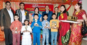 Winners posing for a group photograph along with the chief guest, Navin Agarwal, DG Sports during Annual Day celebration at Kids Kudos Public School. 