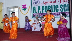Students presenting cultural programme at Hills People School in Jammu on Friday.