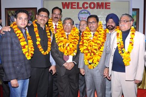 Newly elected office bearers of Chamber of Traders Federation posing for photograph after elections in Jammu on Sunday.