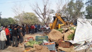JMC enforcement staff demolishing illegal structures in Jammu on Wednesday.
