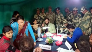 HoD Cardiology GMC Jammu Dr Sushil Sharma examining BSF jawans and their families at IB on Sunday.