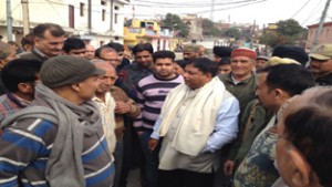 MLA Jammu West, Sat Sharma listening grievances of people in Ward No. 28 on Sunday.