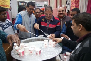 MLA Gandhi Nagar and BJP leaders serving Prasad to devotees at Ganesh Ji Temple Nai Basti, Jammu on Wednesday.