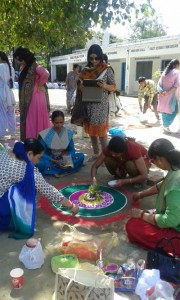 Students displaying their talent during Rangoli contest at Art Camp in Reasi on Saturday.