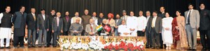 Prime Minister Narendra Modi, Governor N N Vohra, Chief Minister Mufti Mohammad Sayeed and Deputy Chief Minister Dr Nirmal Singh pose with Council of Ministers after the oath ceremony in Jammu on Sunday.           —Excelsior/Rakesh
