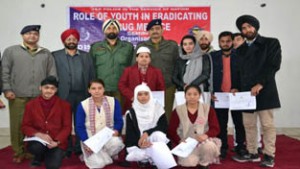 Winners of symposium organized by Poonch Police under CAP posing along with the dignitaries on Monday.