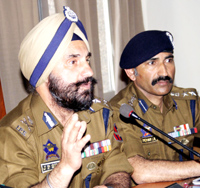 IGP Traffic JP Singh interacting with media persons at Jammu on Thursday. SSP Traffic Mohan Lal also is seen in picture. -Excelsior/Rakesh