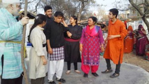 A scene from Hindustani play ‘Nateeja Thunn Thunn Gopal’ staged by ESRM in a Slum Colony at Paloura.