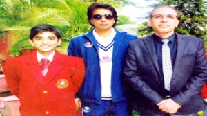 Under-14 cricketer Praful Dhar posing for a photograph along with his Principal, Amarendra Kumar Mishra and coach, Ravi Sharma.