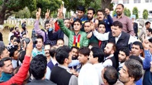 Ghulam Rasool Mir with his supporters showing victory signs after winning election on Wednesday.