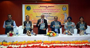 Dy CM Dr Nirmal Singh and others releasing a publication at inaugrual of two-day national seminar at SKUAST Jammu on Thursday.