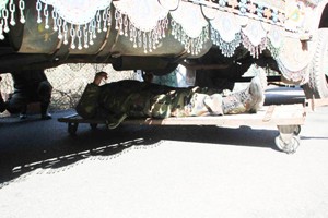 An Army man checking a Pakistani truck at LoC manually in absence of full truck body scanners.  —Excelsior Photo