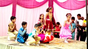 Students performing activity during annual day celebration at Amar Jyoti School, Gujjar Chak in Hiranagar.