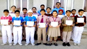 Students of Bhargava Public School who won medals in Science & Math Olympiad posing for a group photograph along with Principal of the school.