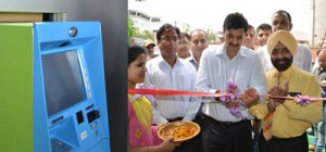 Minister of State for Finance and Information Technology Pawan Gupta inaugurating ATM machine at Battal Ballian road.