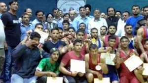 Winners posing for a group photograph along with the dignitaries during concluding function of State Wrestling Championship in Jammu.