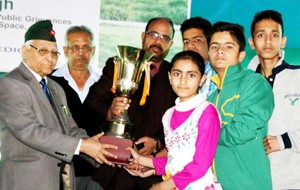 BSF School students posing for a group photograph along with trophy in Jammu. 