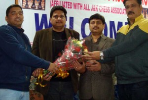 Sanjeev Mahajan being presented bouquet after nominated as chief patron of Chess Association at Jammu on Thursday. 