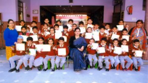 Meritorious students of KC Public School posing along with the dignitaries on Wednesday.