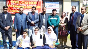 Winners of Declamation contest posing along with dignitaries at Doda on Thursday.