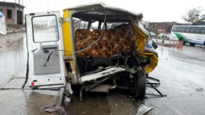 A school van which was hit by a Tata Mahindra at Kalibari, Kathua on Monday. -Excelsior/Madan