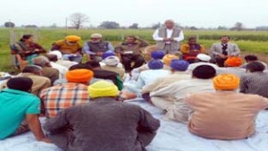 SKUAST-J Scientists apprising farmers about new techniques.