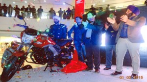 Dignitaries at the launch of new CB Unicorn 160 motorcycle at Honda showroom in Jammu.