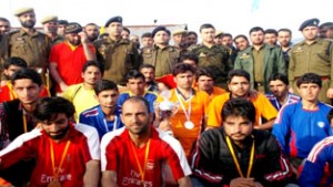 Winners of Volleyball tournament posing for a group photograph at Kupwara in Valley on Thursday.