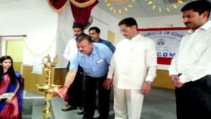 Minister for Industries & Commerce Chander Prakash Ganga lighting traditional lamp during Annual NSS Camp at Village Chak Jaralan, Bishnah in Samba on Thursday.