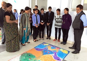 Participants and dignitaries watching beautiful ‘rangolies’ during Rangoli competition at YCET in Jammu. 
