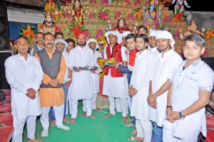 The members of Shiv Mandir and Peer Baba, Om Nagar Udaiwala, Lane Number One during a Jagran on Sunday.