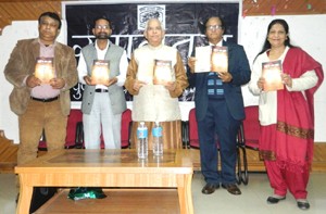 Dignitaries releasing poetry book ‘Ravi Ke Idhar Udhar’ at Jammu on Sunday. 