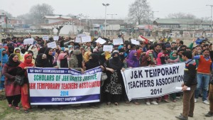 Temporary teachers holding protest march at Srinagar on Tuesday.