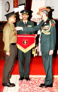 GOC-in-C Northern Command Lt Gen DS Hooda decorating an officer during Investiture Ceremony at Udhampur on Monday.