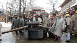People protesting against PDD in Pulwama district on Wednesday.  -Excelsior/Younis Khaliq