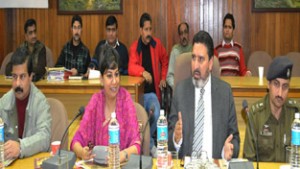 Minister for R&B, Syed Mohammad Altaf Bukhari chairing a meeting at Udhampur on Tuesday.