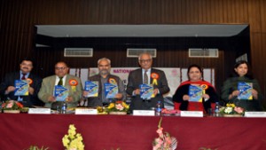 JU VC and others releasing a souvenir during inaugural of two-day seminar on Monday.