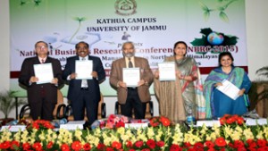 JU VC and others releasing conference proceeding at inaugural of National Business Research Conference on Wednesday.