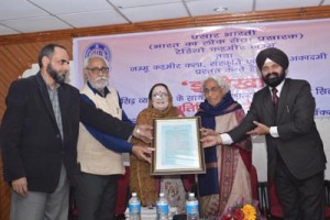Padamshree Prof Ved Ghai receiving a citation from dignitaries during a cultural  programme at Jammu.