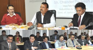 Minister for I&C Chander Parkash chairing a meeting at Jammu on Friday. 
