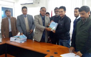 BGSBU VC distributing books among the trainees.